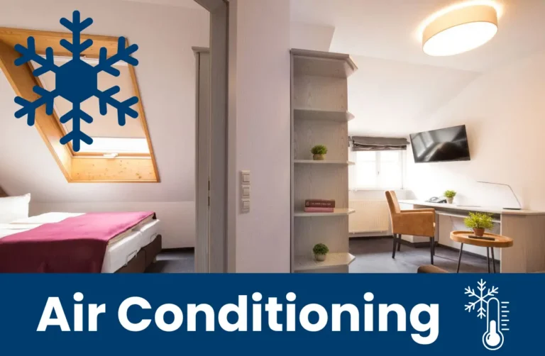 View of a bedroom and a workspace, with a note about the air conditioning